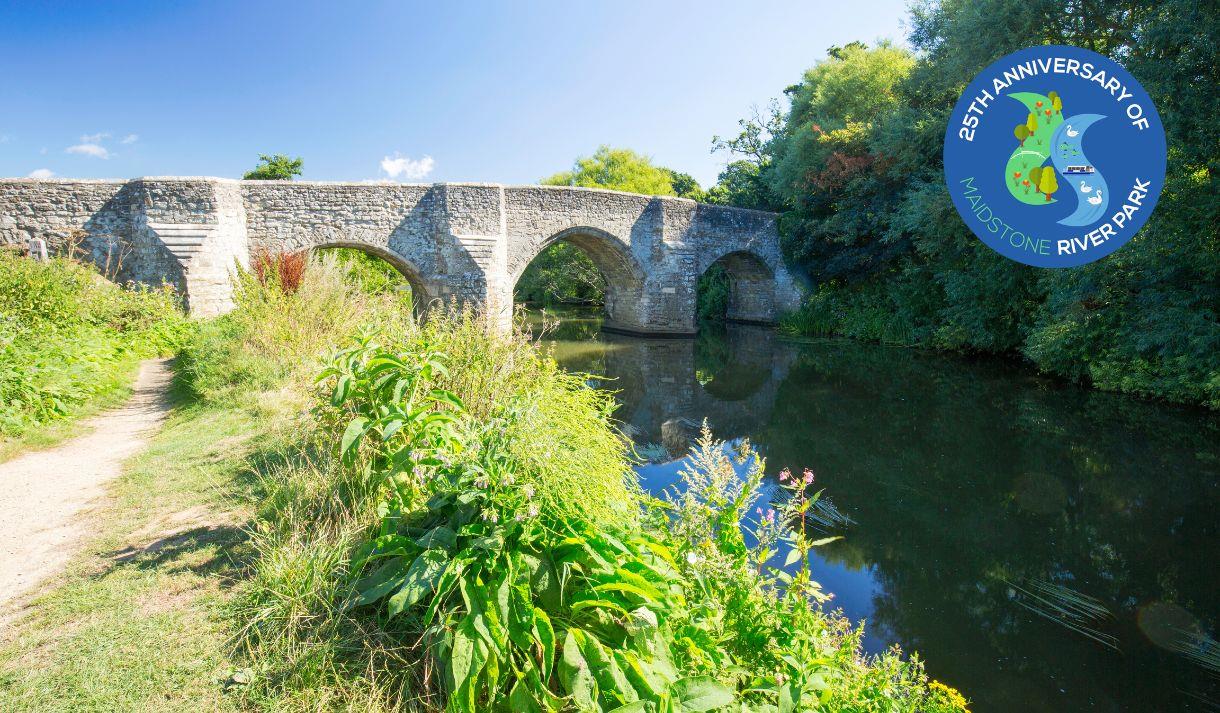A view of the bridge over the River Medway at Teston Country Park with the public footpath to the left