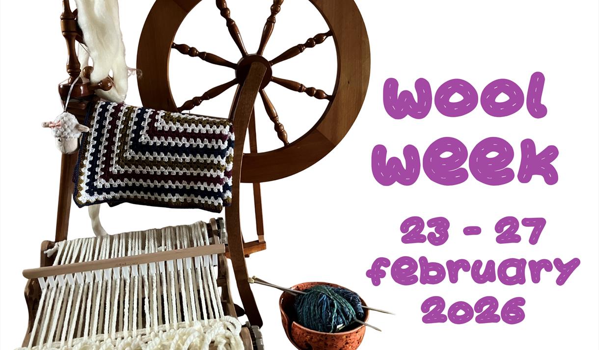 Spinning wheel, heddle loom, crochet bowl and blankets on a white background