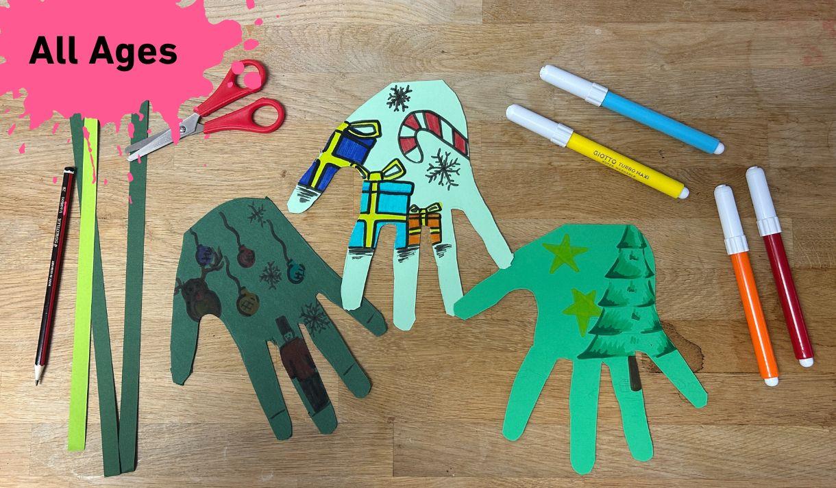 Paper hands to create a Christmas tree
