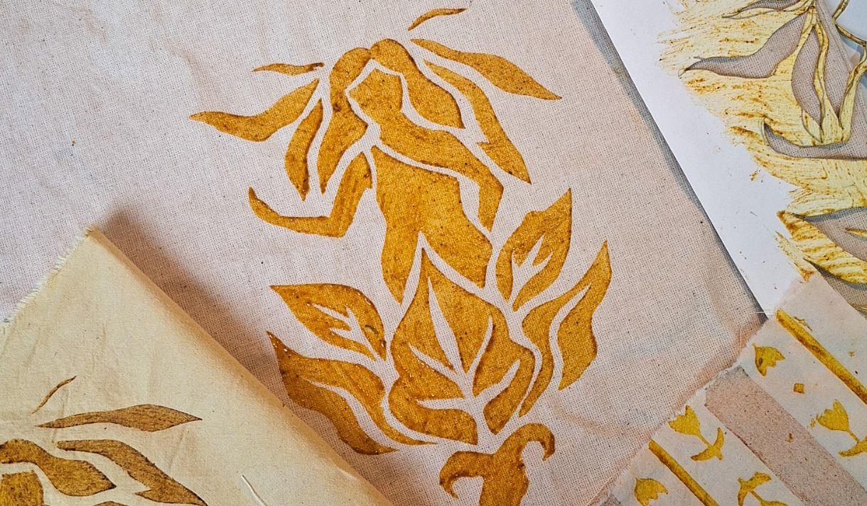 A folk inspired print on a plain tote bag, using natural gold dyes
