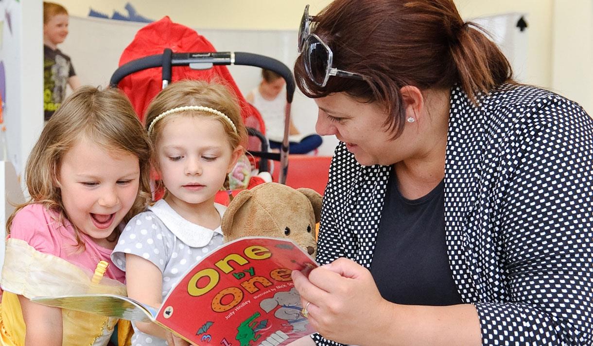 children being read to.