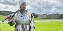 Medieval Knight standing in front of Leeds Castle