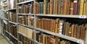 Old books on storage racks in an archive