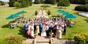 Wedding party outside in grounds of Chilston Park Hotel