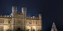 Leeds Castle, lit at night time and a Christmas tree