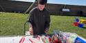 Artist Jacob Montague working on an abstract artwork in the outdoors