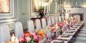 Stunning floral place setting at a wedding in Leeds Castle