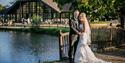 Happy wedding couple outside The Weald of Kent Hotel