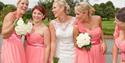 Bridal party in front of lake at Weald of Kent Hotel