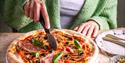 Lady eating pizza