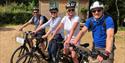 Two couples with bikes