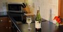 Wine in kitchen at Brick Kiln Cottage