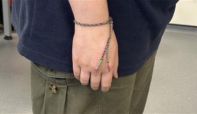 Woven bracelet around wrist