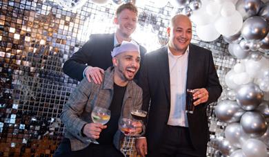 People with Christmas hats at a party