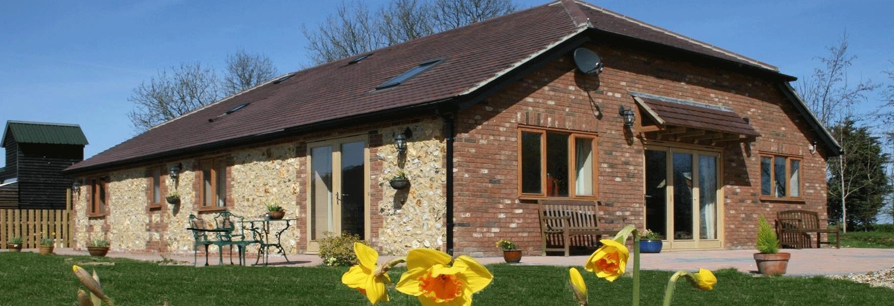 Flint Lodge at Coldblow Farm, top of the North Downs, near Maidstone, Kent.  Fully accessible and perfect for a family who need accessible accommodation. Great patio and barbecue area