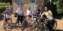 five ladies with bikes