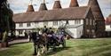 Horse and carriage outside The Hop Farm