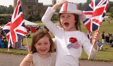 Little girls with United Kingdom flags at Leeds Castle