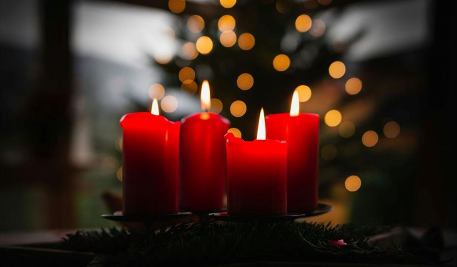 Four lit red candles Four lit red candles