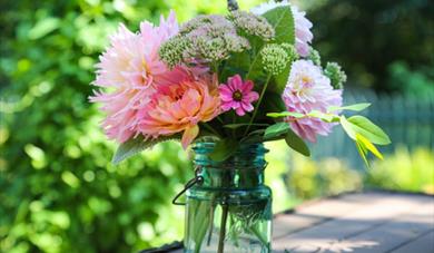 Flowers in a vase including dahlias