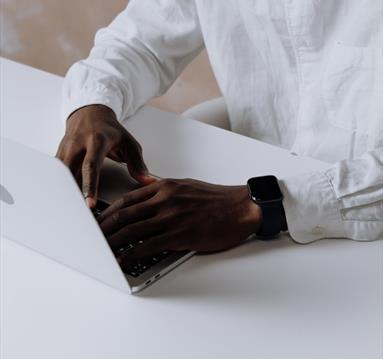 Hands on a laptop