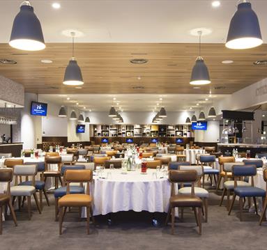 Hospitality suite with chairs and tables set out at Manchester City Football Club