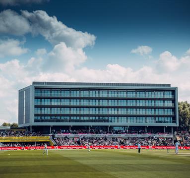 Emirates Old Trafford cricket ground with match being played and crowd