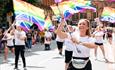 People on Parade with rainbow flags