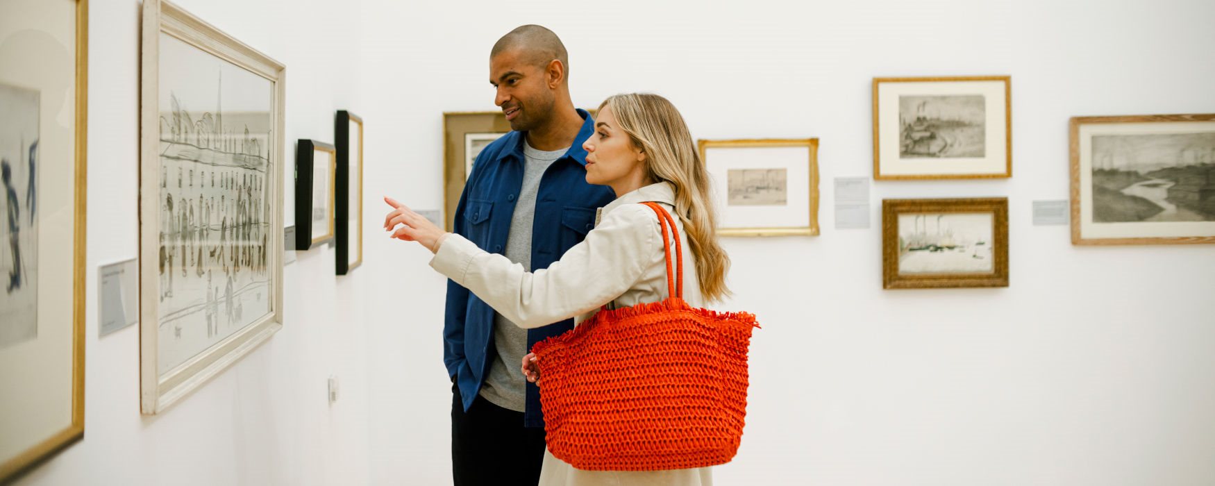 Couple looking at artwork in The Lowry