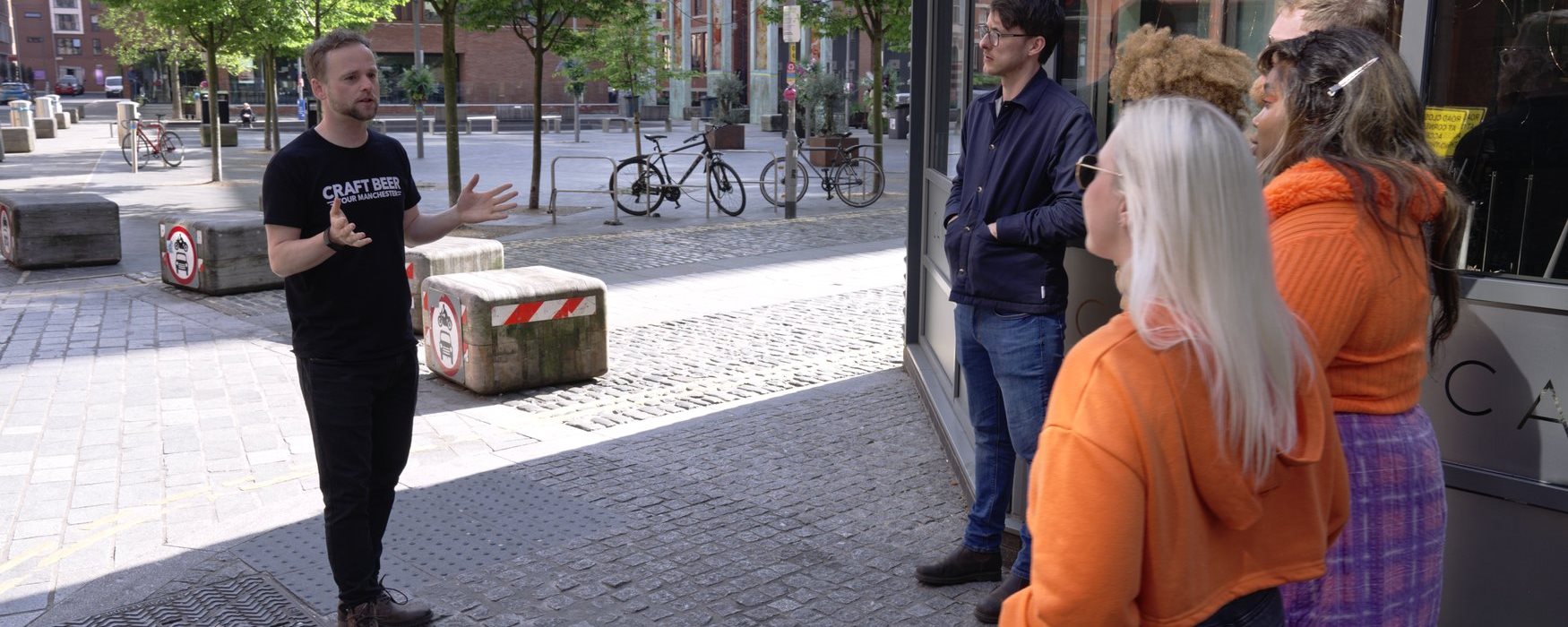 Tour guide talking to a group in Manchester City Centre