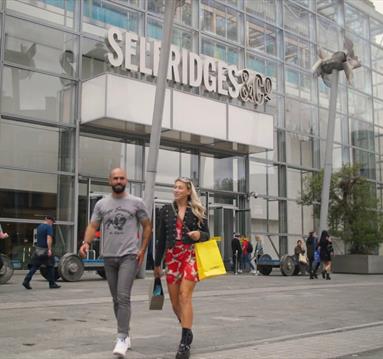 Two shoppers outside Selfridges, Manchester.