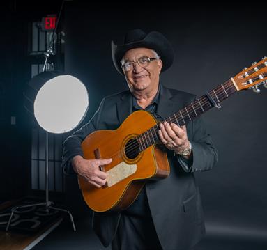 Eliades Ochoa with a guitar