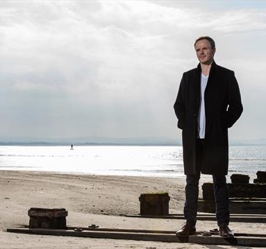 Ashley Wass, sea in the background