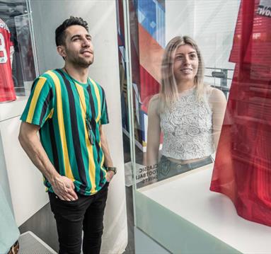 People in an exhibition in the National Football Museum