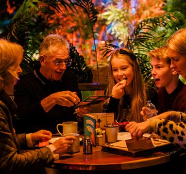 Family enjoying food at Treetop Adventure Golf
