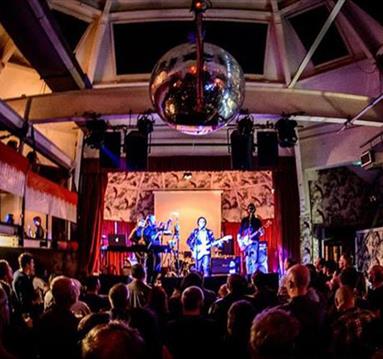 Band playing to crowd at The Deaf Institute