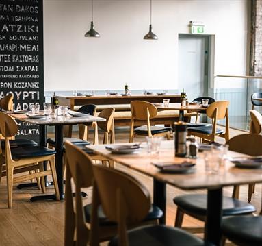 Interior dining setup at The Real Greek, Corn Exchange, Manchester