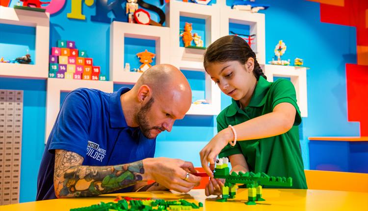 People building LEGO