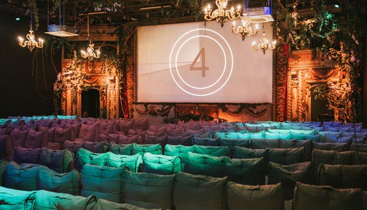 Cinema with coloured seats and large screen