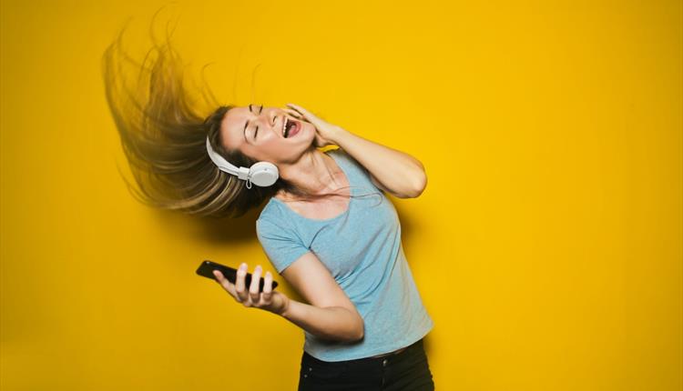 Photography of Woman Listening to Music