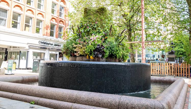Floral feature around fountain in Manchester
