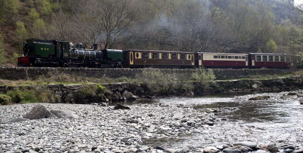 Train on the West Highland Railway, with river in front