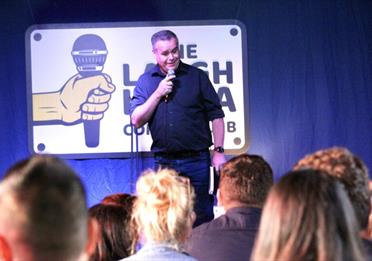 Comic on stage