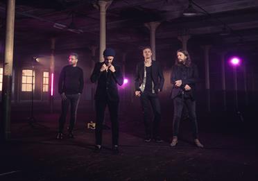 The Slow Showband members, dark background