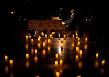 Piano surrounded with candles