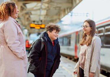 Family next to a train