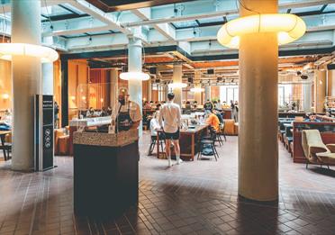 Interior shot with people at Ducie Street Warehouse