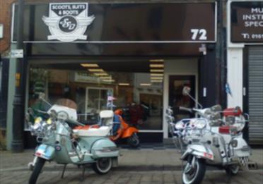 Scoots Suits and Boots shop front, scooters and shop