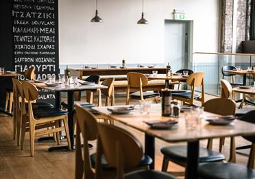 Interior dining setup at The Real Greek, Corn Exchange, Manchester