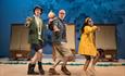We're Going on a Bear Hunt: actors on stage, dressed in waterproofs